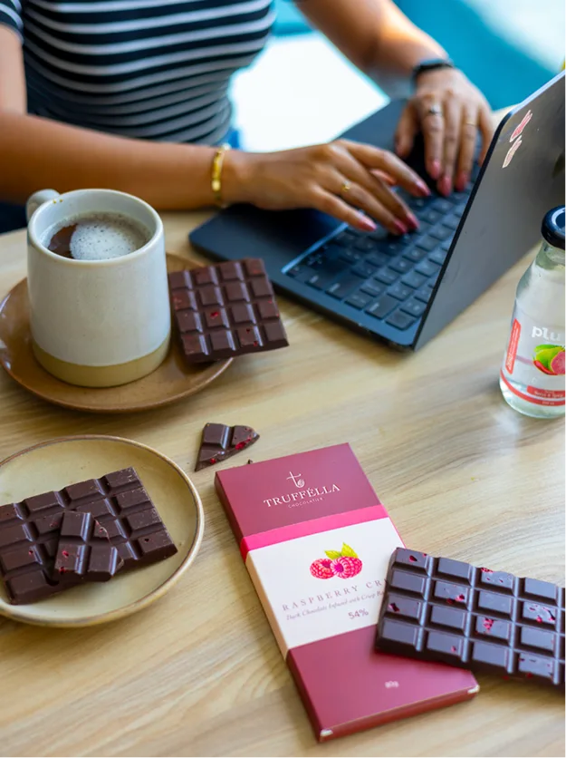 Raspberry Crunch chocolate bar on a work desk