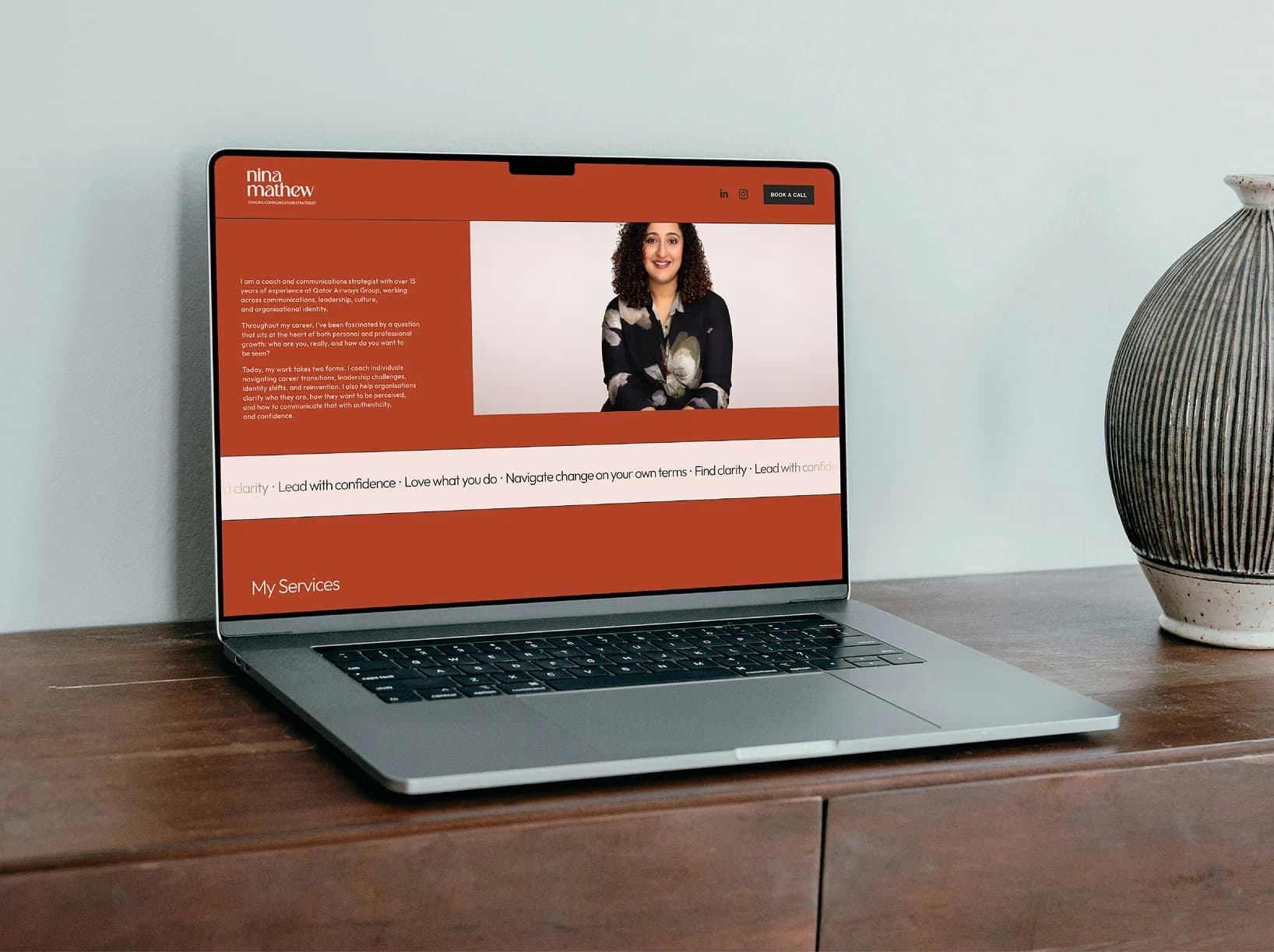 Nina Mathew website design shown on a laptop